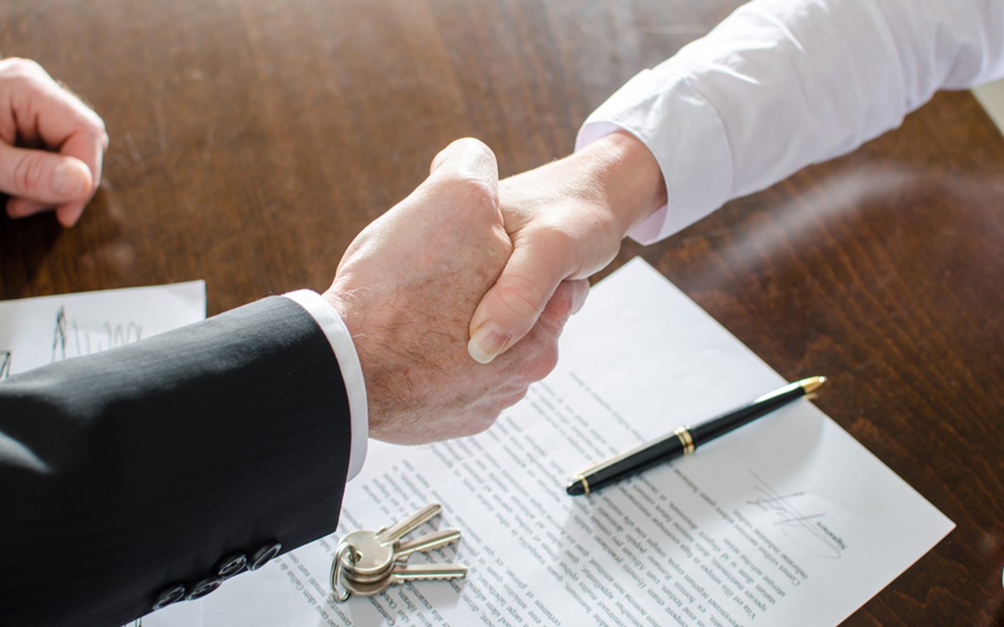 Business Loans - shaking hands over contract